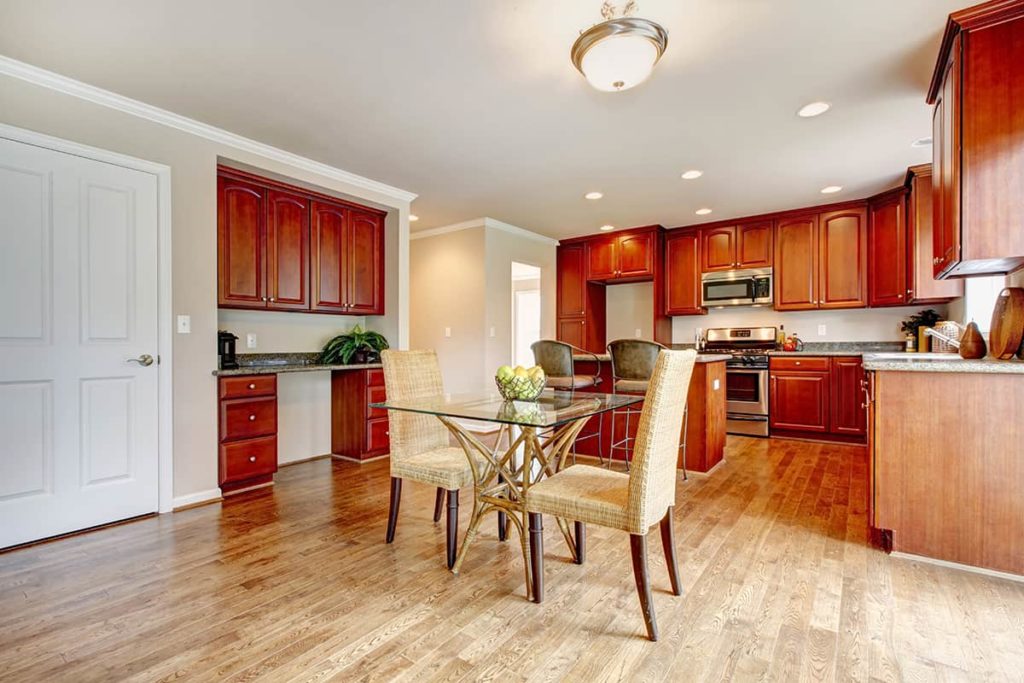 Cherry Cabinets With Pale Colored Hardwood Floors